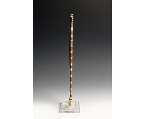 λ  A 19th century Persian turned ivory and polychrome decorated baton, 39.4cm long.