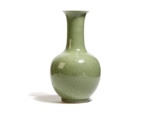 A Chinese porcelain celadon glazed bottle vase, with scrolling lotus leaf decoration, with a six character Kangxi seal mark, 