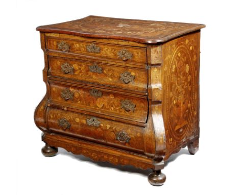 A late 18th century Dutch walnut and marquetry bomb commode, inlaid with urns of flowers, birds and leaves, the serpentine to