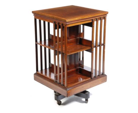 An Edwardian revolving mahogany bookcase, inlaid with stringing and satinwood banding, on ceramic castors, 86.6cm high, 49.7c
