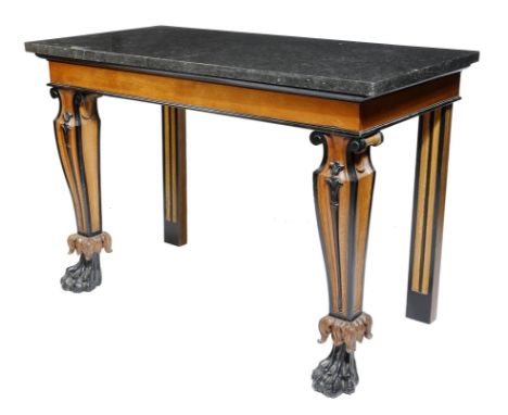 A 19th century oak and ebonized console table, the black marble top above a plain frieze and carved scroll and leaf tapering 
