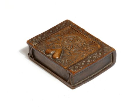 An early 19th century treen chip carved snuff box in the form of a book, the sliding cover decorated with flowers and a heart