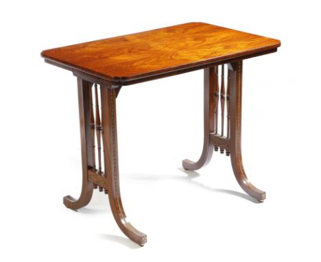 λ  A Regency rosewood centre table attributed to Gillows, with gilt brass mounts, the top with bookmatched veneers with re-en
