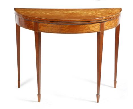 A George III satinwood demi-lune card table, inlaid with stringing, the fold-over top with kingwood crossbanding, revealing a