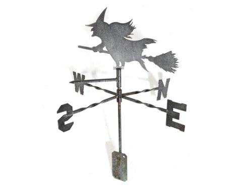 A patinated metal weather vane, with a witch riding her broomstick, 76cm high, 63.1cm wide.