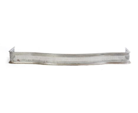 A 19th century steel serpentine fender, 12.9cm high, 140.8cm wide, 43.5cm deep.
