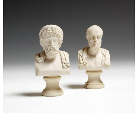 λ  Two 19th century carved ivory portrait busts of Plato and Aristotle, each on a turned socle, 10cm high (max). (2)  Provena