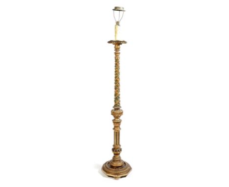 An Italian painted and carved giltwood standard lamp, the spiral fluted stem decorated with leaves and fruit, late 19th / ear
