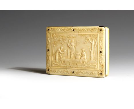 λ  A late 18th century ivory snuff box, the hinged lid with a chinoiserie scene with figures and trees, in a scroll and leaf 