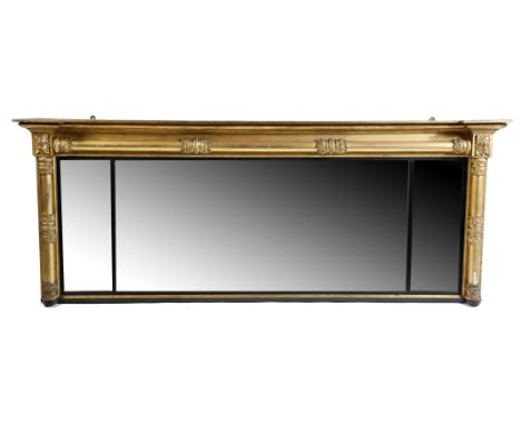 A William IV giltwood and ebonised landscape overmantel mirror, with three rectangular plates, with reeded slips, within a ba