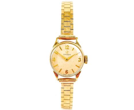 An Omega 1950's 9ct gold-cased lady's manual wind bracelet wristwatch. Cal. 244, the signed 18mm cream dial with gilt 3,6,9,1