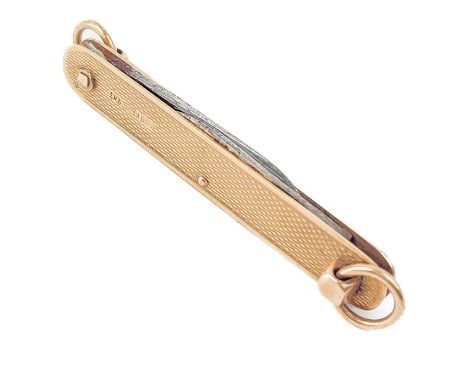 A 9ct gold cased folding combination pocket knife fob. With engine turned decoration hallmarked Birmingham 1937, with two ste
