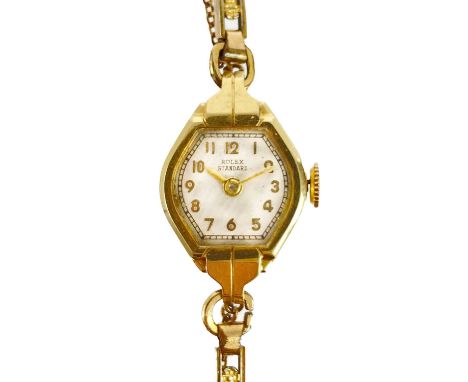Rolex - A Rolex Standard 14ct cased lady's manual wind wristwatch.  The 14mm dial signed ROLEX STANDARD, signed 17 jewel move