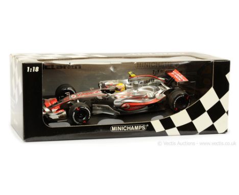 Minichamps (1/18 Scale) 530071822 McLaren Mercedes MP4-22 "Lewis Hamilton" - 1st Win - chrome plated finish with orange "Voda