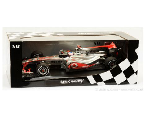 Minichamps (1/18 Scale) McLaren Mercedes MP4-25 "Jensen Button 2010" - finished in chrome, red "Vodafone" advertising - Mint 