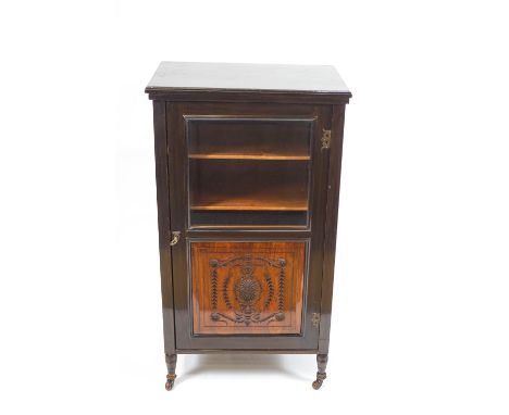 An Edwardian painted finish hardwood music cabinet, the front set a bevelled glass plate over a panel carved with a swagged p