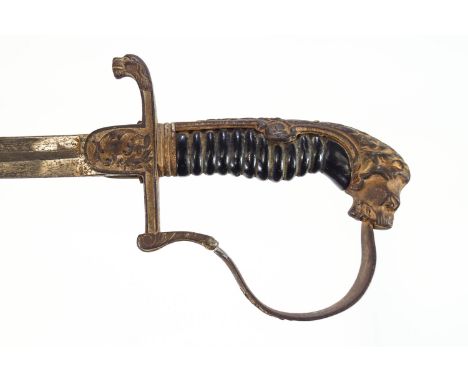 A Prussian style sabre in a metal scabbard, the handle decorated with a lions mask and oak leaves