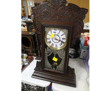 Carved and cased antique table clock