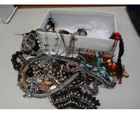 Box of costume jewellery, boxed lighter etc