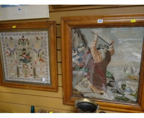 Vintage framed cross-stitch embroidery of Moses with the tablets together with a framed embroidered sampler