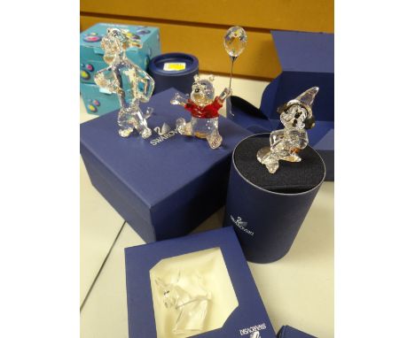 Four boxed Swarovski crystal glass Disney characters including Winnie the Pooh etcCondition report: the donkey character is s