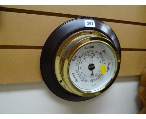 Modern brass effect and mahogany circular barometer