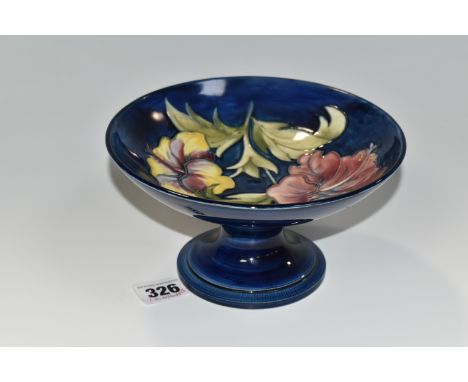 A MOORCROFT POTTERY HIBISCUS PATTERN COMPORT, decorated in the Hibiscus pattern on a blue ground, signed and impressed marks 