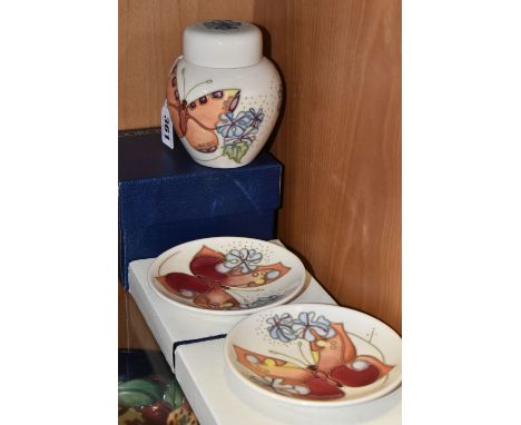 A BOXED MOORCROFT POTTERY 'BUTTERFLY' PATTERN GINGER JAR AND TWO BOXED TRINKET DISHES, designed by Sally Tuffin, tube lined w