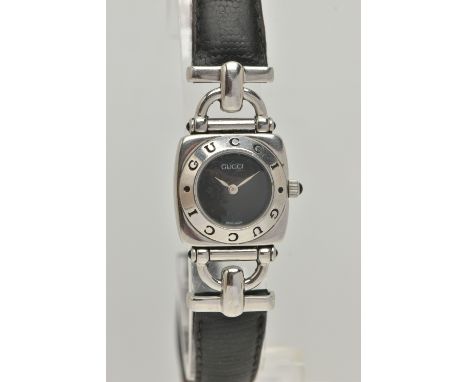 A LADIES 'GUCCI' QUARTZ WRISTWATCH, with a round black dial, singed 'Gucci', bezel signed Gucci twice, polished square case, 