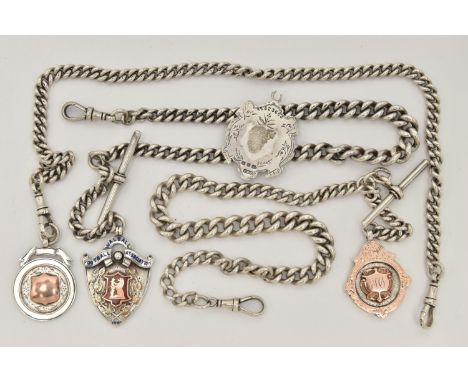 THREE LATE 19TH TO EARLY 20TH CENTURY SILVER ALBERT CHAINS AND FOUR MEDALLIONS, all curb link chains with lobster claw clasps
