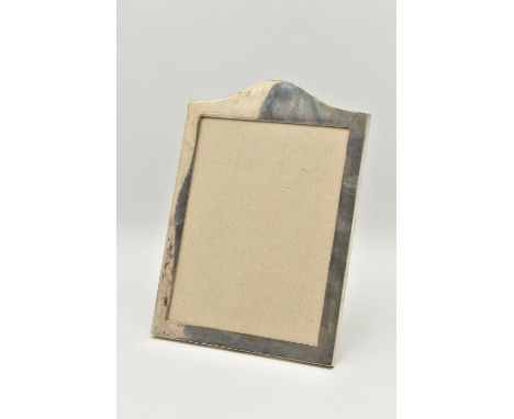 A POLISHED SILVER PHOTO FRAME, rectangular form with curved top, missing glass front, fitted with a AF stand, hallmarked 'E M