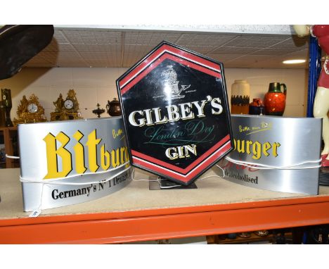 THREE LIGHT UP BAR SIGNS to include a Bitburger sign  approximately 50cm width x 25cm height, a Bitburger Drive sign approxim