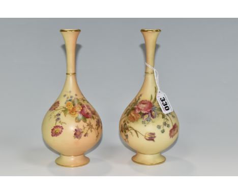 TWO ROYAL WORCESTER BLUSH IVORY VASES, Hadleys shape 307 bottle vases, decorated with floral sprays, both with puce backstamp