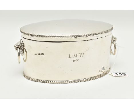 A GEORGE V SILVER BISCUIT/CRACKER BARREL OF OVAL FORM WITH LION MASK RING HANDLES, cast rims, the front of the base engraved 