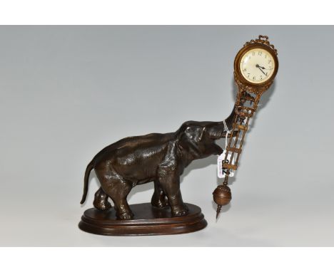 A SPELTER SWINGING ELEPHANT CLOCK, a twentieth century spelter elephant clock, the dial and movement incorporated into a swin
