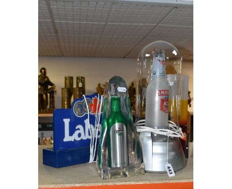 FOUR PIECES OF BAR DECORATIONS to include a Labatt's light up sign with UK plug, a Heineken bottle in resin ornament, a light