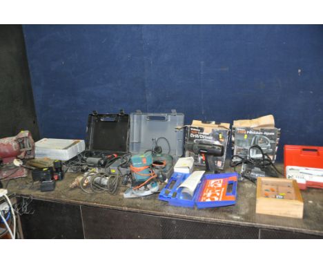 A COLLECTION OF POWER TOOLS including a Black and Decker KD574CRE drill, a Skil 12v drill with one battery and charger, a Wic