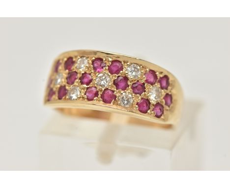 A 14CT YELLOW GOLD RUBY AND DIAMOND SET RING, pave set with circular cut rubies and brilliant cut diamonds, approximate ring 