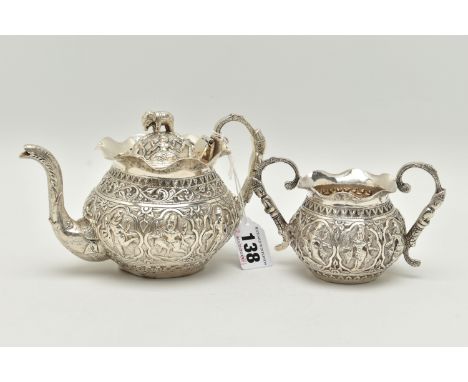 AN INDIAN WHITE METAL TWO PIECE BACHELOR'S TEA SET, comprising teapot and twin handled sugar bowl, elephant finial to the tea