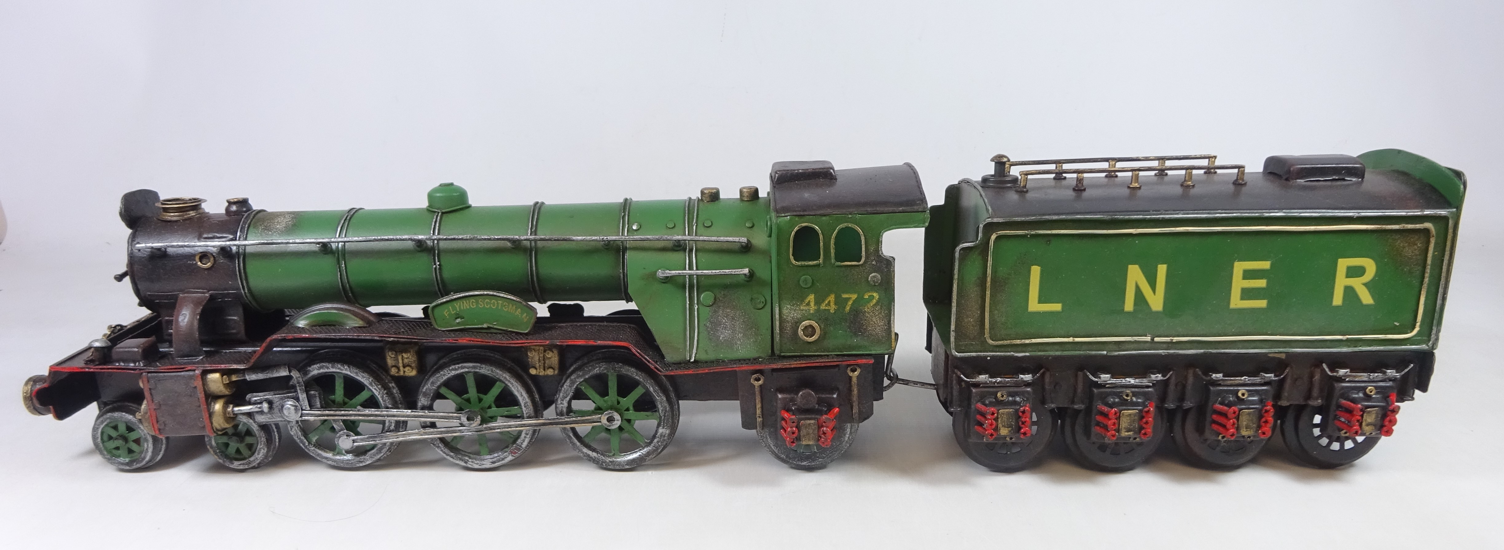 Tinplate model of the Flying Scotsman and Tender, boxed L64cm Condition ...