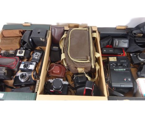 Praktica Super TL1000 SLR camera with lenses, Polaroid and other vintage cameras in three boxes   Condition Report   Click he