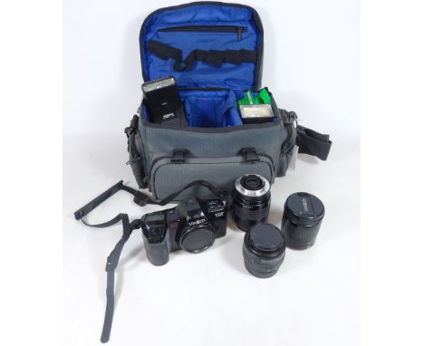 Minolta DYNAX 7000i with three lenses, two flash units and other accessories in camera bag    Condition Report   Click here f