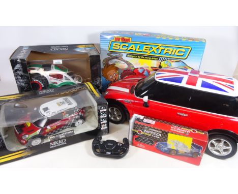 Two Nikko radio control cars, 'My First Scalextric', Eztec radio control Subaru Impreza and a RC Mini Cooper L57cm -  mostly 