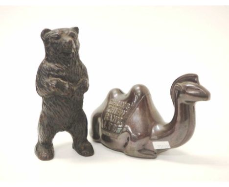 Two vintage money boxes comprising of a cast iron bear (15.5cm high) and a Chung Khiaw Bank camel