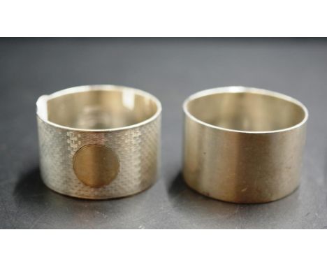 Australian sterling silver napkin ring engine turned by SD &amp; Co together with an English hallmarked napkin ring,