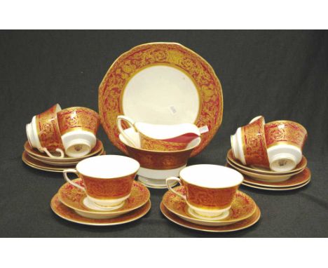 Twenty one piece Royal Worcester tea set Circa 1930's with burgundy and ornate gilt border, comprising 6 trios, a cake plate,