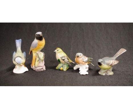 Five various European bird figurines including Worcester, Beswick and Goebel