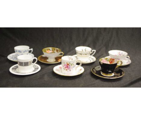 Seven various decorated coffee cups & saucers including: a Royal Crown Derby, 'Derby Posies,' cup & saucer; a Wedgwood, 'Asia