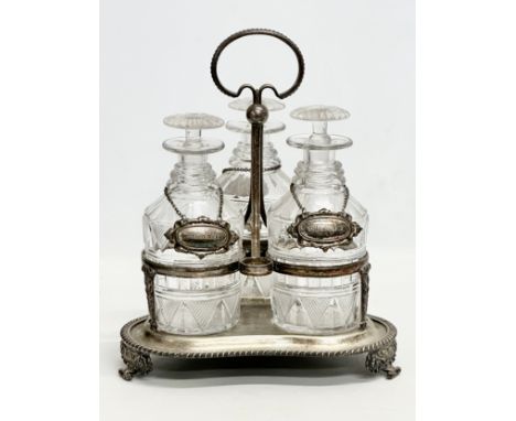 A 19th Century Victorian 3 glass decanter set on stand. With 3 rings and silver plated labels. Whiskey, Gin and Brandy. Silve