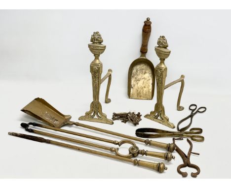 A quantity of 19th and Early 20th Century brassware. Early 20th Century fire andirons and fire tools. 5 Late Victorian brass 
